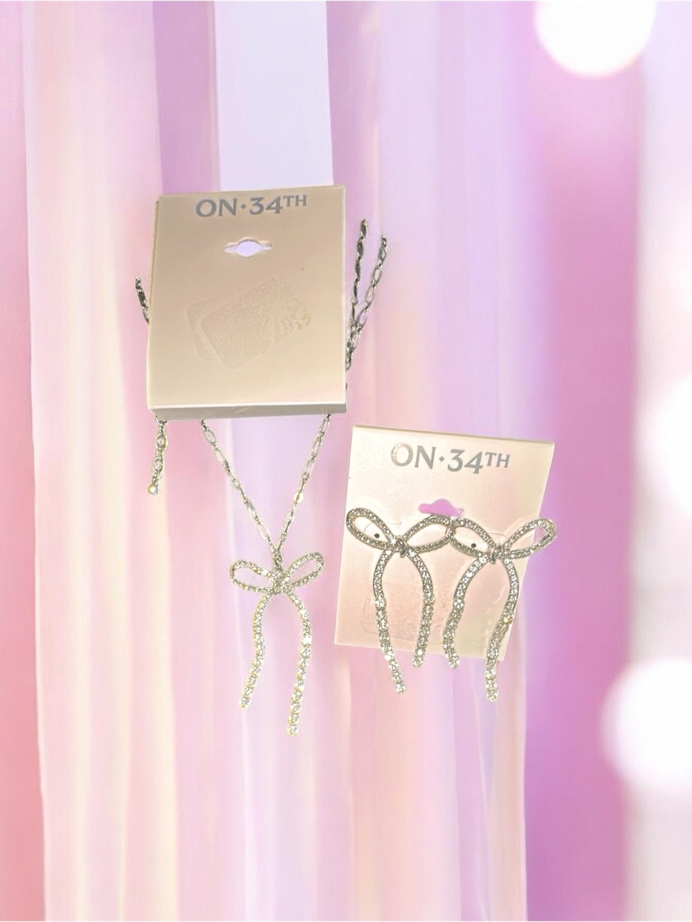 ON-34th earrings and necklace set Silvertone, glistening beautiful drop stones .